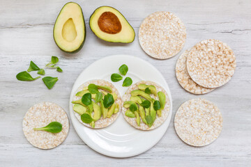 Crispy rice cakes with sliced avocado. Healthy and fresh breakfast. Healthy and vegan concept 