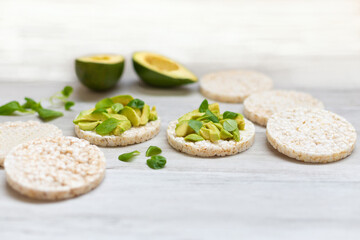 Crispy rice cakes with sliced avocado. Healthy and fresh breakfast. Healthy and vegan concept 