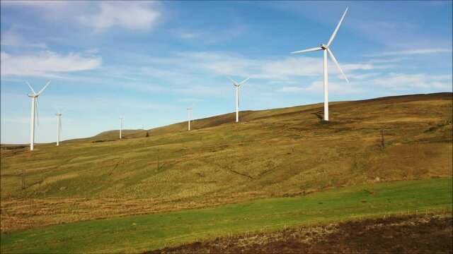 Drone footage of secluded wind turbine farm located on the hills above Lough Fea in northern ireland