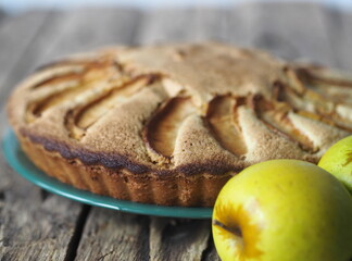 Homemade cake.Sponge Apple pie on a wooden table.