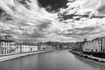 Beautiful black and white view of the Lungarni of Pisa, Italy, of the historic center with the Church of Santa Maria della Spina from the Solferino bridge