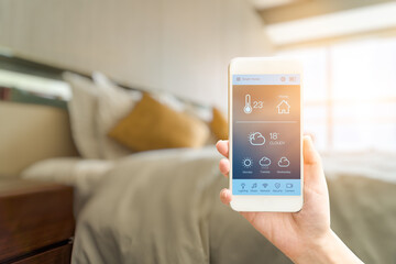 mobile phone with smart home app in modern living room