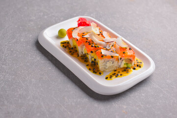 Fresh maki and nigiri sushi rolls with tuna fish and cheese. Asian Japanese cuisine concept.