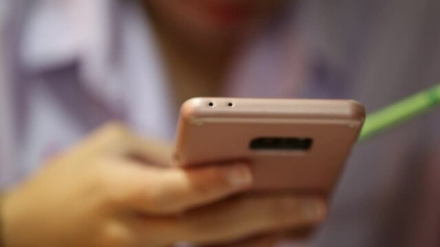 Closeup of woman hand holding smartphone