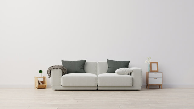 Living room interior wall mockup with gray velvet sofa, gray pillows, plaid and green plant branch in vase on empty white wall background. 3D rendering