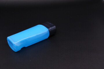 liquid soap or body foam blue transparent  isolated on black background