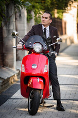 Fototapeta premium young man on a scooter