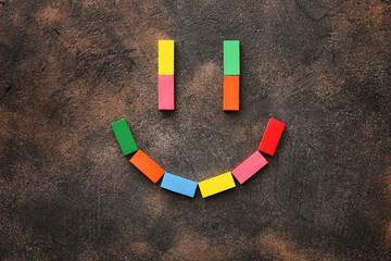 Smile made of blocks on dark background