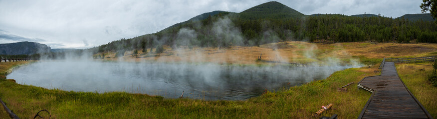 panorama of steaming lake in Yellowstone National Park