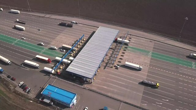 Aerial view of highway with Cars at modern toll road turnpike, entry fee pay gate