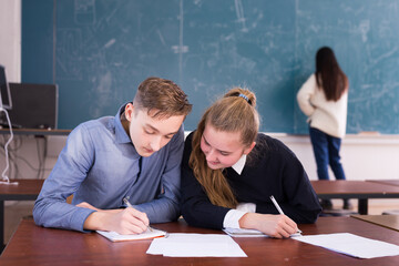 Two students studying in classroom