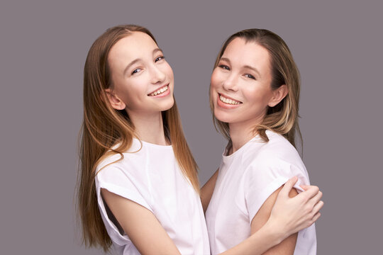 Elder Mother And Teenager Daughter Hug. Happy Family Portrait. Similar Smile. Next Generation Love. Single Mom. Mature Parent. Smiling People Group. Attractive Posing Together. Two Hand Connection