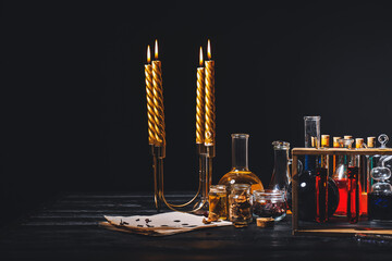 Potions and candles on alchemist's table
