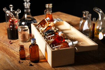 Fototapeta na wymiar Different potions on alchemist's table