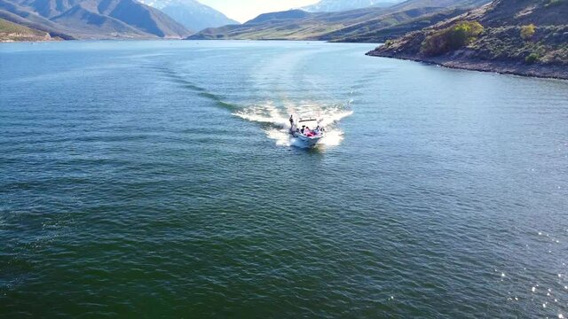 Wake surfing at the lake. Boating is a wonderful summer activity when you can surf and the water is smooth