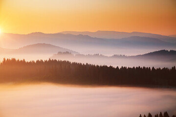 Fototapeta premium Evening mountains landscape are illuminated by the sunset.