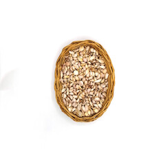 Top view of Garlic Cloves in wooden basket on white background