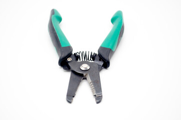 cable peeling pliers with green handle isolated on white background