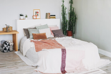 Scandinavian modern cozy bright interior in bedroom, big green house plant