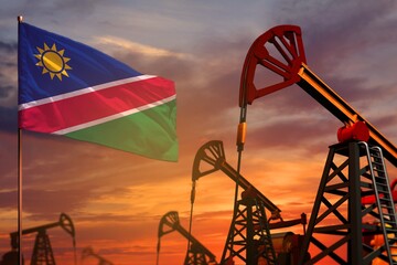 Namibia oil industry concept. Industrial illustration - Namibia flag and oil wells with the red and blue sunset or sunrise sky background - 3D illustration