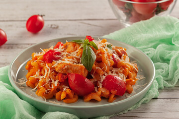 Pasta with cherry tomatoes and basil. Italian food. Italian Cuisine. Homemade food. The concept of tasty and healthy food.