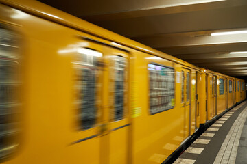 subway train car rides through station