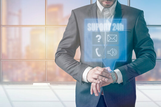 Businessman using modern smartwatch pressing button on virtual hologram