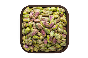 pistachios nuts peeled in square bowl isolated on white background. organic food, top view.