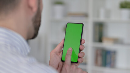 Man using Smartphone with Chroma Key Screen 