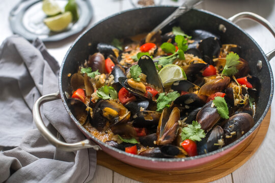 Cooked Mussels with rice and sauce