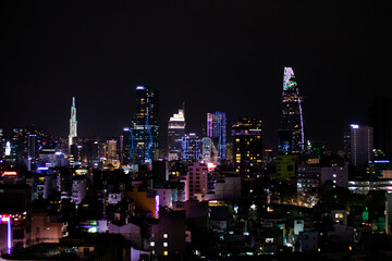 Fototapeta na wymiar Ho Chi Minh city skyline at night. Skyscrapers, apartment buildings. Saigon Skydeck (Bitexco), Vincom Landmark 81. Ho Chi Minh - Saigon, Vietnam, Southeast Asia