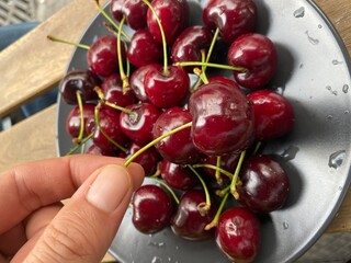 top view hand holding cherry