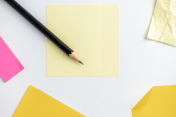 Office desk table pencil and post it on white background.