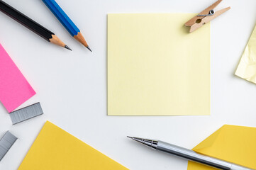 Office desk table pencil and post it on white background.