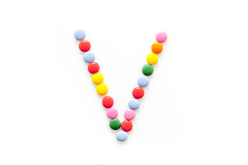 Candies font alphabet. Letter V isolated top view