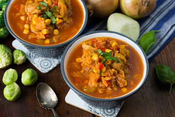 Soup with cabbage, brussel sprouts, sweet corn, pepper and tomatoes. Lecho.