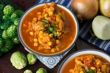 Soup with cabbage, brussel sprouts, sweet corn, pepper and tomatoes. Lecho.