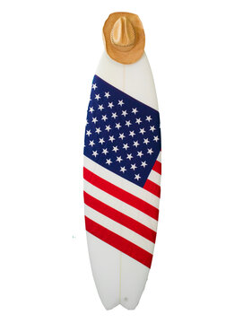 American Flag On A White Surfboard, USA Stars & Stripes, Paddles & A Straw Cowboy Hat. Shaka Hand Sign. This Is Known As The Red, White And Blue. Surfing Is A Lifestyle.