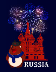 Russia. Brown bear in hat and scarf at Red Square in Moscow. Fireworks behind the St. Basil's Cathedral silhouette. Blue background
