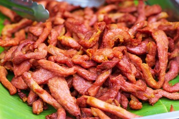 Close up of deep fried dried pork thai street food market