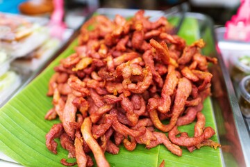 Close up of deep fried dried pork thai street food market