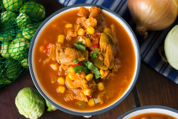 Soup with cabbage, brussel sprouts, sweet corn, pepper and tomatoes. Lecho.