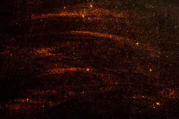 Abstract dark background with sequins.