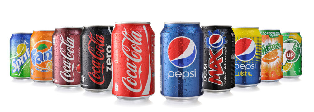 Collection of various brands of soda drinks in aluminum cans isolated on white. Brands included in this group are Coca Cola, Pepsi, Sprite, Fanta, 7up, Mirinda, Schweppes