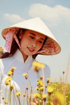 Artistic portrait: a girl in a flower field in Hoang Dau, Vietnam