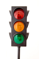Traffic lights - toy isolated on white background: