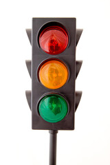Traffic lights - toy isolated on white background:
