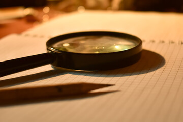 magnifying glass on a book