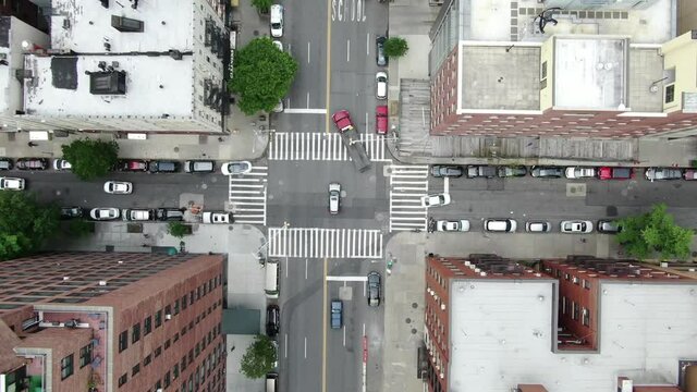 overhead aerial cars driving in Midtown Manhattan traffic New York City NYC centered 