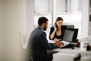 Portrait of businesswoman in factory. Young female architect in suit.	